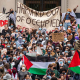 Protesters at Harvard University show their support for Palestinians in Gaza at a rally in Cambridge, Mass., on Oct. 14, 2023.